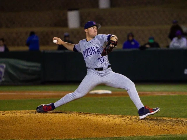 A baseball pitcher on the pitchers mound throws a baseball