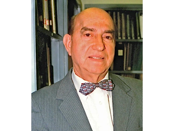 man wearing suit and bow tie